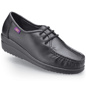 A classic look that cradles your feet in comfort and unbeatable slip-resistance. You just might sign up for an extra shift once you step into this lightweight design made with full grain water-resistant leather. It also features our patented shock-absorbing SFC Mighty Grip outsole cushioned insoles and a steel shank for all day safety comfort and support. The rubber heel measures 1¼". Shoes For Crews - Comfortably Yours - Black / Women’s Non Skid Casual Shoes