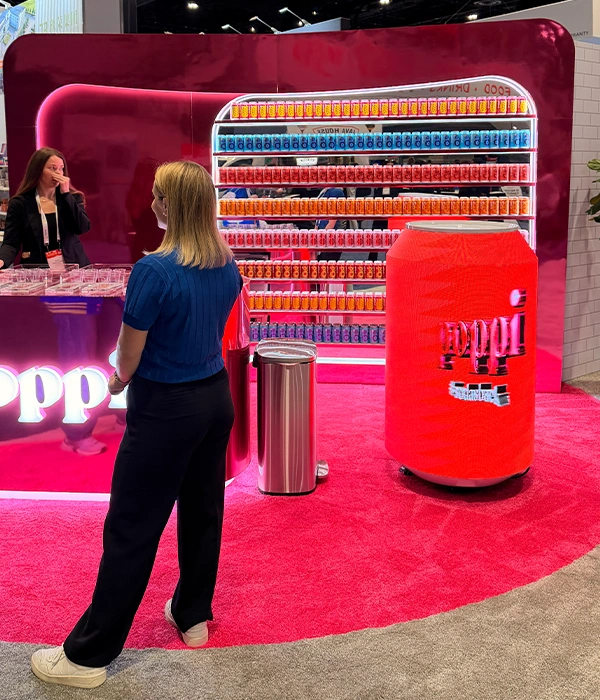 Poppi booth with giant can display